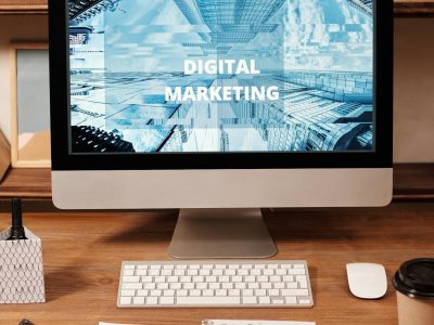 Contemporary office setup featuring digital marketing strategy on a computer screen, ideal for business technology themes.