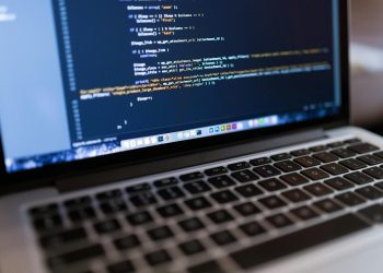Focused view of programming code displayed on a laptop, ideal for tech and coding themes.